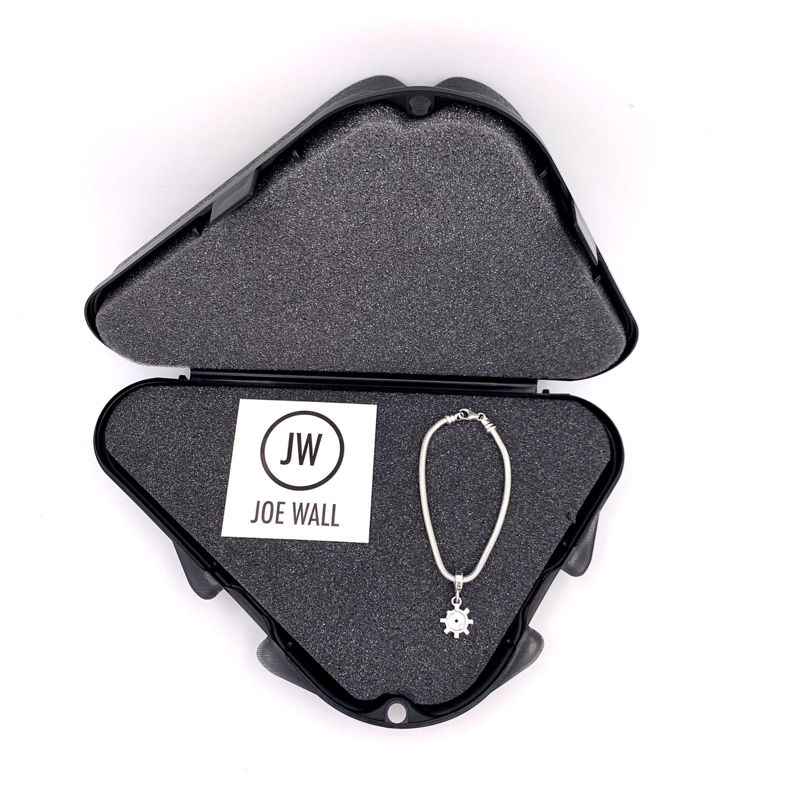 Charms with bracelet or chain ship in a small, plastic gun case gift box